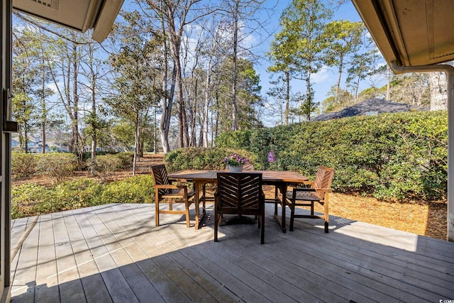 wooden deck with outdoor dining area