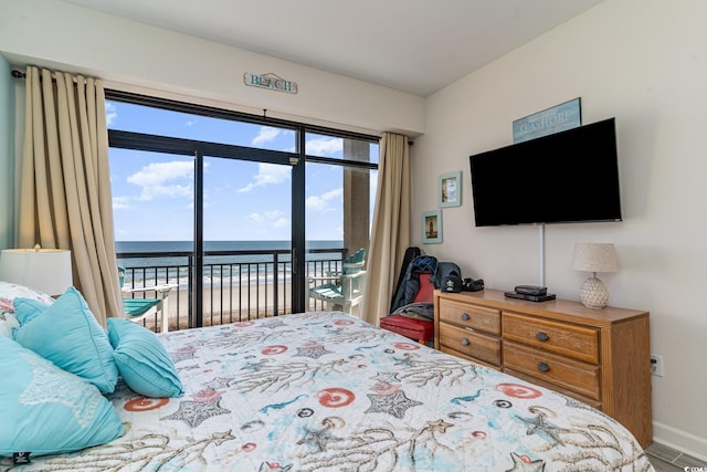 bedroom with baseboards and access to exterior