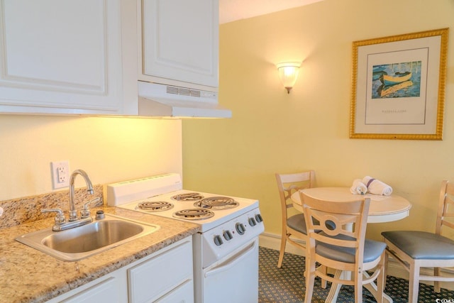 kitchen featuring white range with electric cooktop, light countertops, white cabinets, a sink, and under cabinet range hood