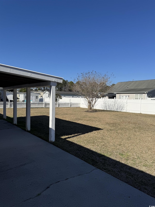 view of yard with a fenced backyard