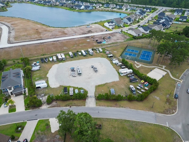 aerial view featuring a residential view and a water view