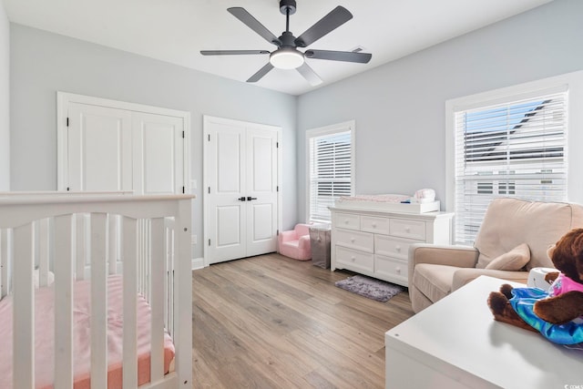 bedroom with light wood-type flooring and ceiling fan