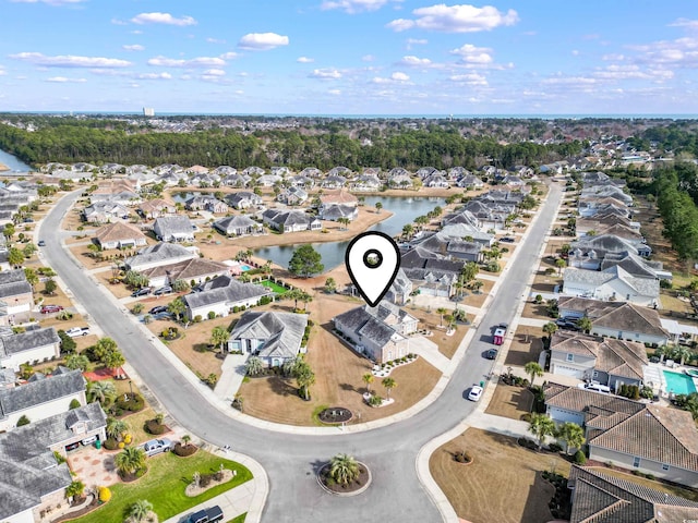 birds eye view of property with a residential view and a water view