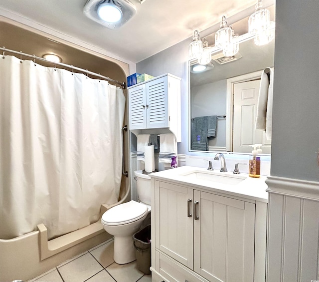 full bathroom featuring toilet, vanity, and tile patterned flooring