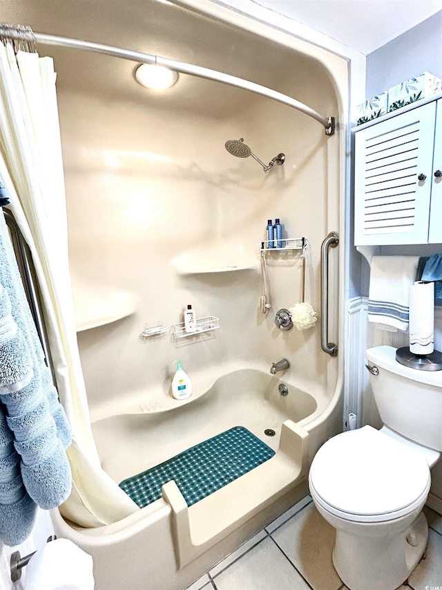 bathroom featuring tile patterned flooring, shower / tub combo, and toilet