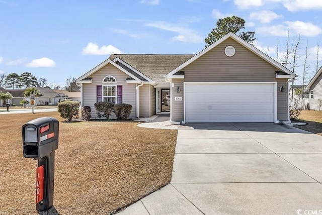 ranch-style home featuring concrete driveway and an attached garage