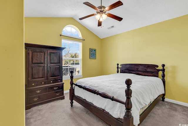 bedroom featuring lofted ceiling, baseboards, visible vents, and light colored carpet