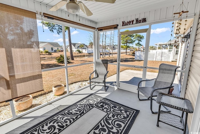 sunroom / solarium featuring ceiling fan