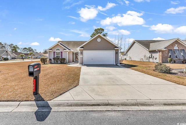 view of front of house with a front yard, driveway, and an attached garage