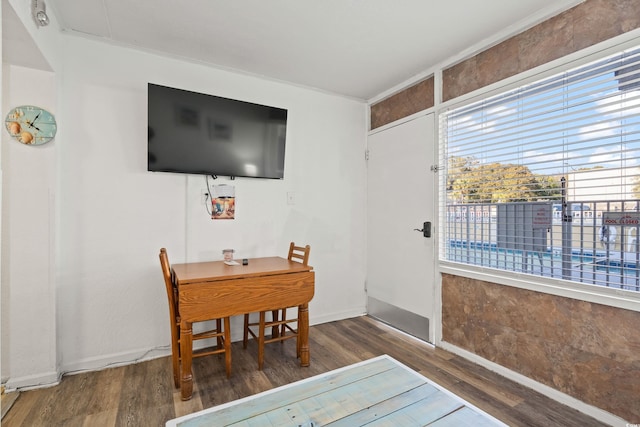 dining room with wood finished floors and baseboards