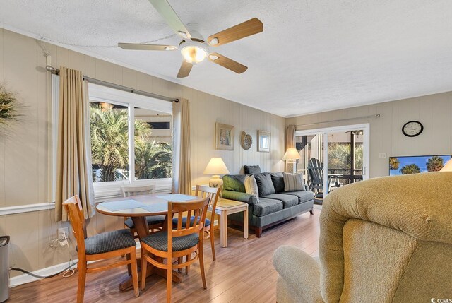 9501 Shore Dr Unit D-132, Myrtle Beach, SC 29572 - living area with a textured ceiling, ceiling fan, and light wood finished floors