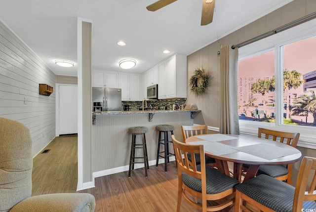 9501 Shore Dr Unit D-132, Myrtle Beach, SC 29572 - dining space featuring ceiling fan and light wood-type flooring