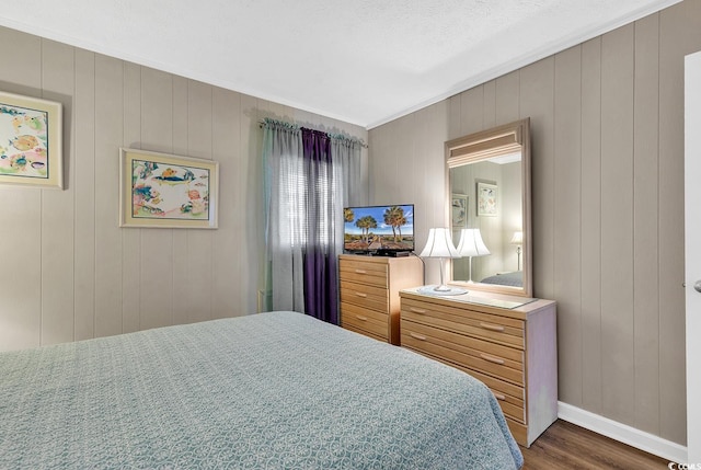 9501 Shore Dr Unit D-132, Myrtle Beach, SC 29572 - bedroom featuring ornamental molding, wood finished floors, and baseboards