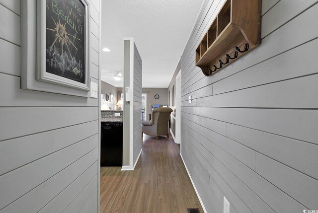 9501 Shore Dr Unit D-132, Myrtle Beach, SC 29572 - corridor featuring light wood finished floors, wooden walls, and baseboards
