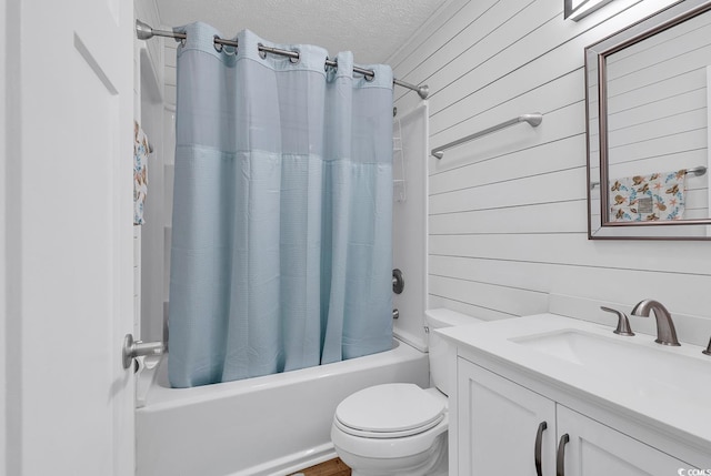9501 Shore Dr Unit D-132, Myrtle Beach, SC 29572 - bathroom featuring shower / tub combo with curtain, toilet, wooden walls, a textured ceiling, and vanity