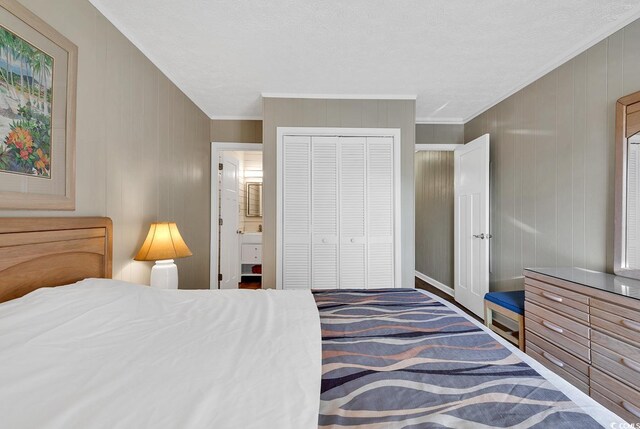 9501 Shore Dr Unit D-132, Myrtle Beach, SC 29572 - bedroom with a closet, ensuite bath, and crown molding