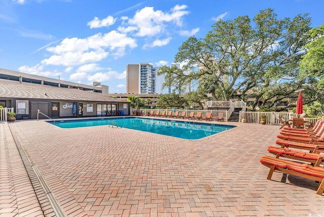 9501 Shore Dr Unit D-132, Myrtle Beach, SC 29572 - community pool with a patio area and stairs