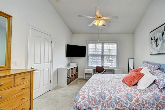 bedroom with baseboards, light carpet, ceiling fan, and vaulted ceiling