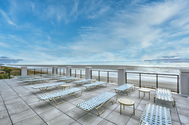 view of patio with a water view