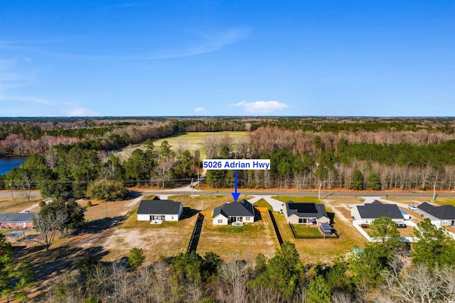 bird's eye view featuring a residential view and a forest view