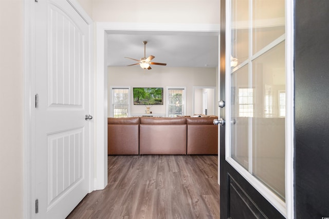 living room with ceiling fan and wood finished floors