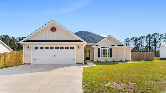 view of front facade featuring driveway, an attached garage, fence, and a front lawn