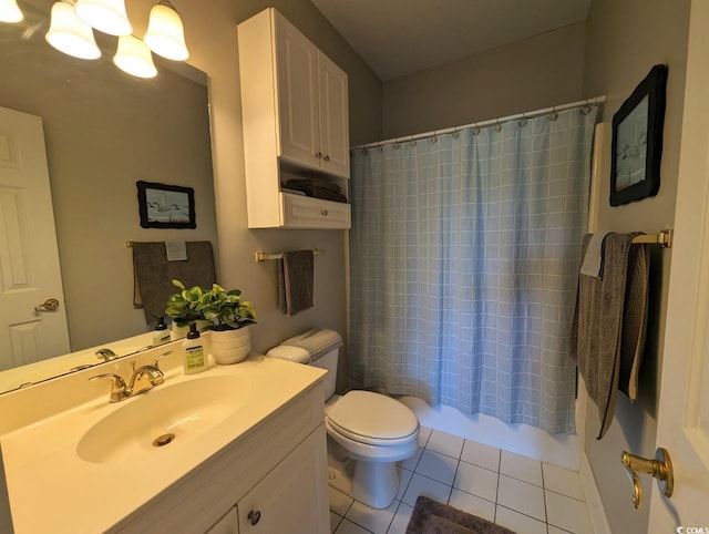 bathroom with shower / bath combo, vanity, toilet, and tile patterned floors