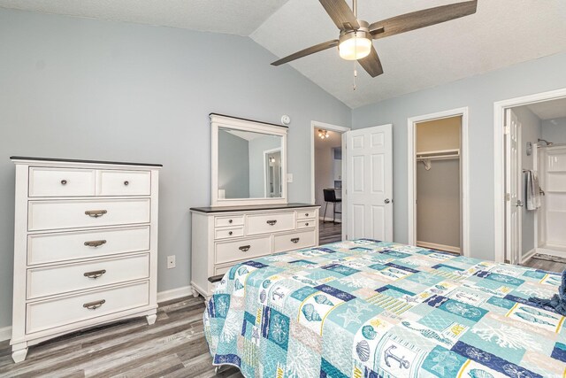 bedroom featuring vaulted ceiling, ceiling fan, baseboards, and light wood-style floors