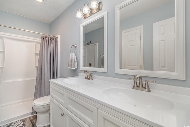 full bathroom with a shower with curtain, a sink, and double vanity