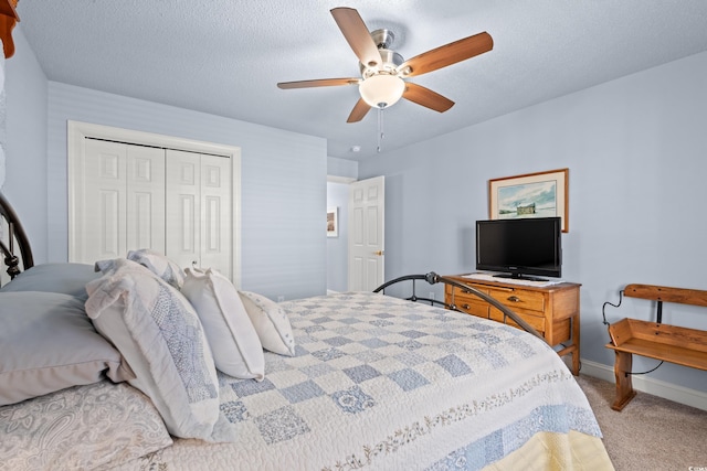 3516 Queens Harbour Blvd, Myrtle Beach, SC 29588 - bedroom featuring a closet, light carpet, a ceiling fan, and a textured ceiling