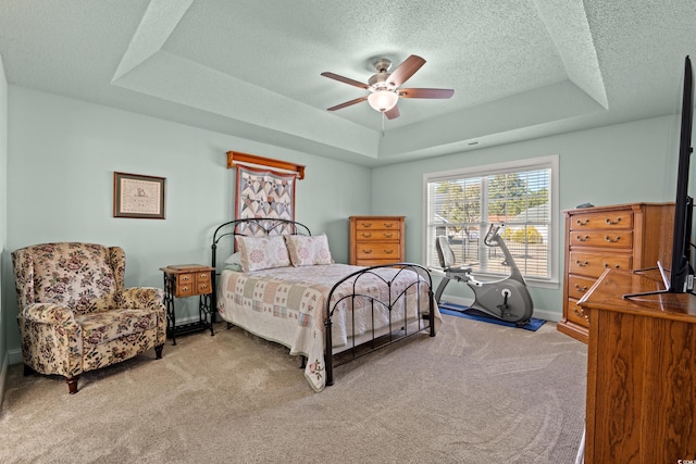 3516 Queens Harbour Blvd, Myrtle Beach, SC 29588 - carpeted bedroom featuring a tray ceiling, a textured ceiling, and a ceiling fan