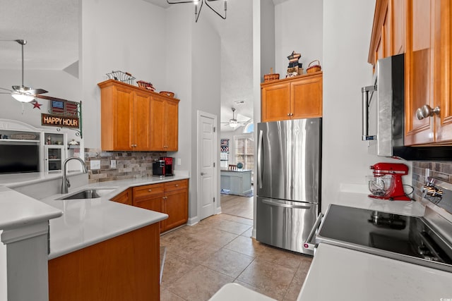 3516 Queens Harbour Blvd, Myrtle Beach, SC 29588 - kitchen featuring stainless steel appliances, a ceiling fan, high vaulted ceiling, and tasteful backsplash