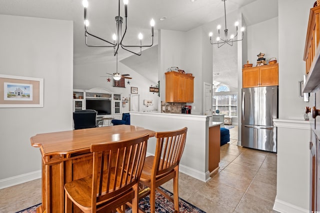 3516 Queens Harbour Blvd, Myrtle Beach, SC 29588 - dining area with a chandelier, high vaulted ceiling, ceiling fan, light tile patterned floors, and a desk