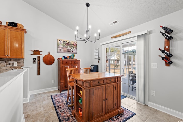 3516 Queens Harbour Blvd, Myrtle Beach, SC 29588 - dining room featuring a chandelier, light tile patterned floors, and vaulted ceiling