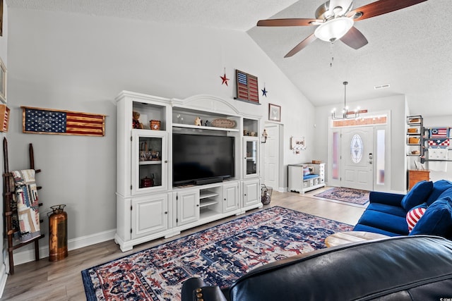 3516 Queens Harbour Blvd, Myrtle Beach, SC 29588 - living room featuring light wood-style flooring, a ceiling fan, a textured ceiling, and high vaulted ceiling