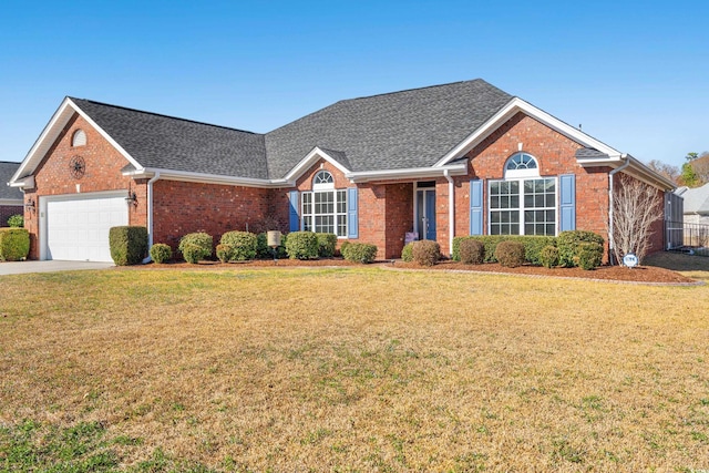 single story home featuring a garage, brick siding, concrete driveway, roof with shingles, and a front yard