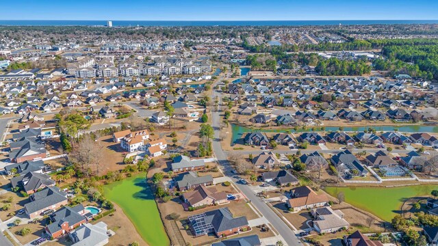 3516 Queens Harbour Blvd, Myrtle Beach, SC 29588 - aerial view of property and surrounding area with a large body of water and nearby suburban area