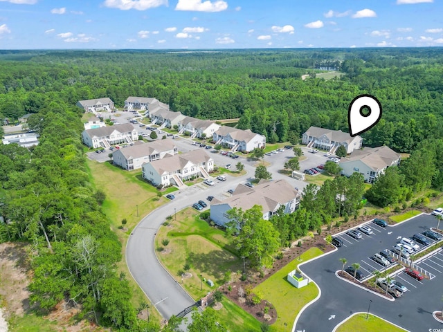 bird's eye view with a forest view and a residential view