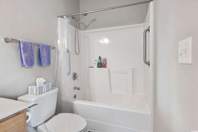 bathroom with shower / bath combo, vanity, and toilet