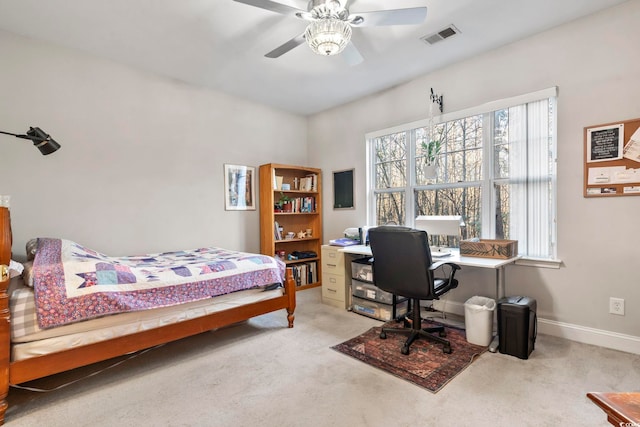 carpeted bedroom featuring ceiling fan, visible vents, and baseboards