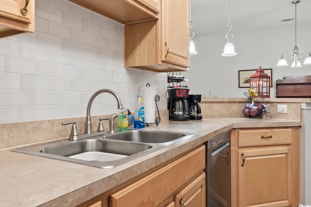 kitchen featuring stainless steel dishwasher, decorative backsplash, light countertops, and a sink