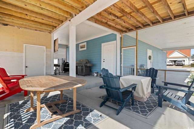 view of patio with outdoor dining space and grilling area