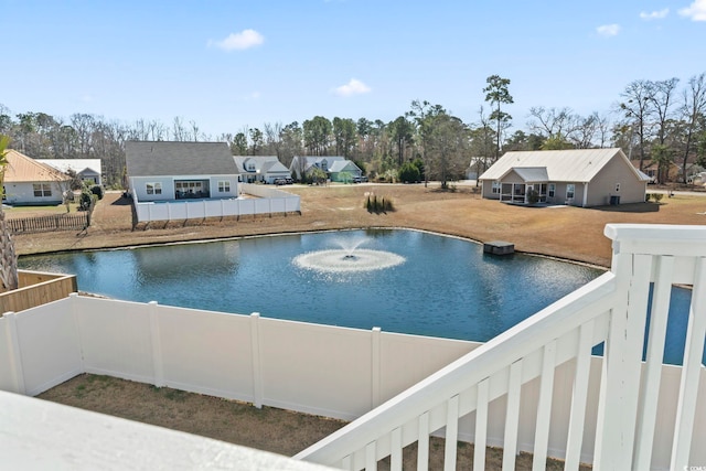 view of swimming pool featuring fence