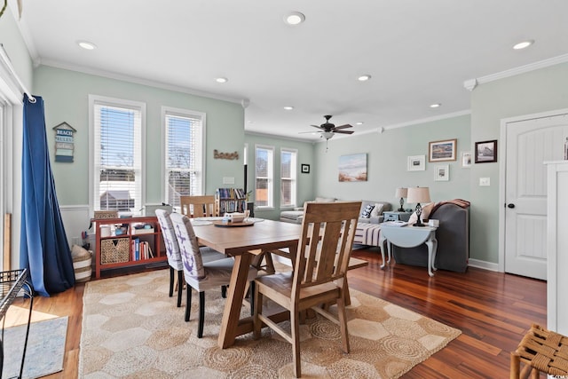 dining area with recessed lighting, wood finished floors, and crown molding