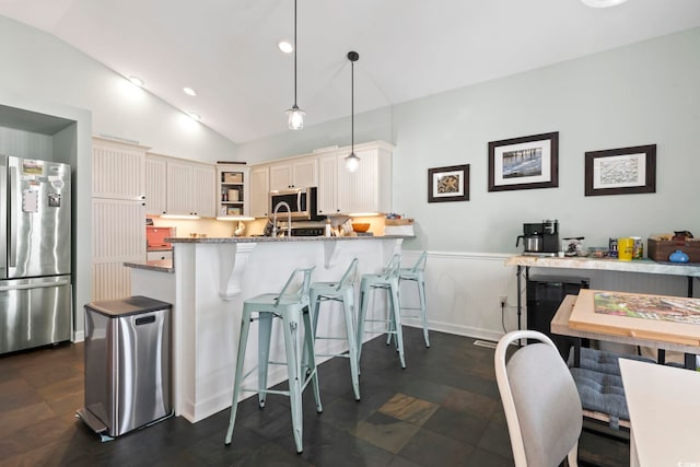 kitchen with open shelves, stainless steel appliances, lofted ceiling, a peninsula, and a kitchen bar