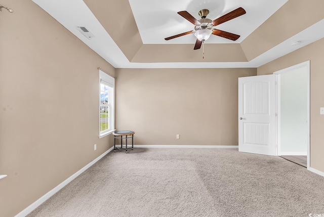 206 Balsa Dr, Longs, SC 29568 - carpeted spare room featuring a tray ceiling, ceiling fan, and a smoke detector