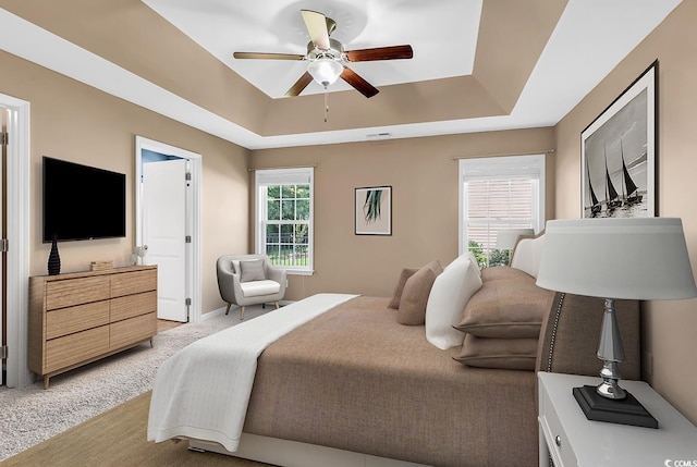 206 Balsa Dr, Longs, SC 29568 - bedroom with a raised ceiling, light carpet, and a ceiling fan