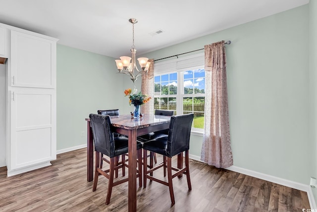 206 Balsa Dr, Longs, SC 29568 - dining area featuring light wood-type flooring and a chandelier