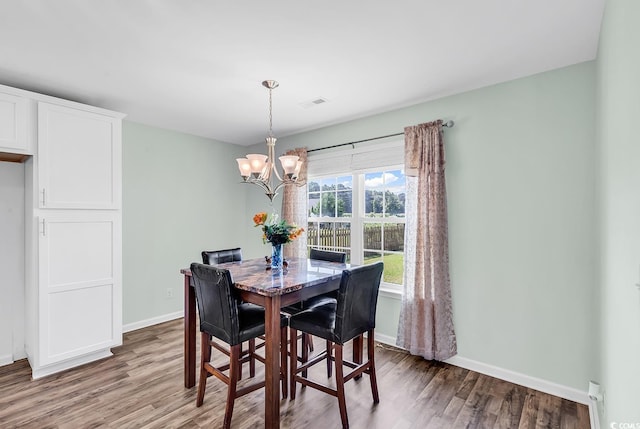 206 Balsa Dr, Longs, SC 29568 - dining space with wood finished floors and a chandelier