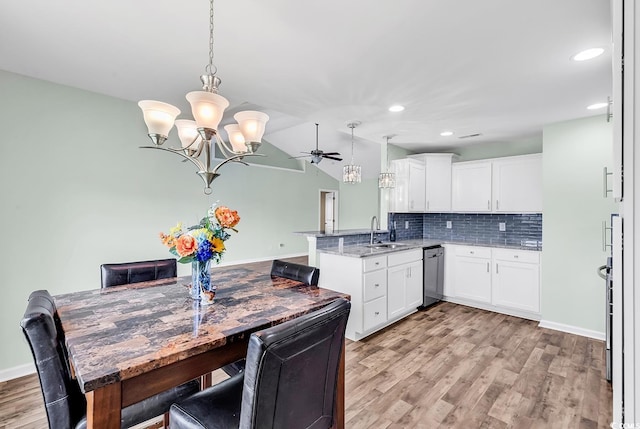 206 Balsa Dr, Longs, SC 29568 - kitchen featuring dishwasher, a chandelier, a peninsula, light wood-style flooring, and tasteful backsplash